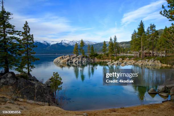 lake tahoe with snow capped mountain - snow top mountain pine tree stock pictures, royalty-free photos & images