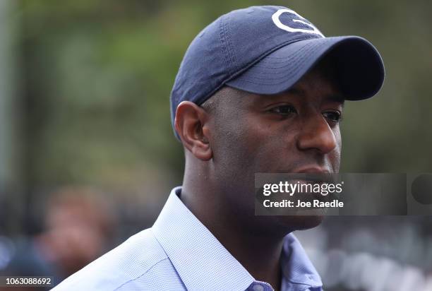 Florida Democratic governor candidate Andrew Gillum greets people as he stumps for votes during a visit to the L.A. Lee Terrace apartment complex on...