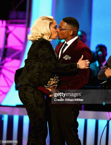 Stevie J presents the Lady of Soul award to his wife Faith Evans onstage during the 2018 Soul Train Awards, presented by BET, at the Orleans Arena on...