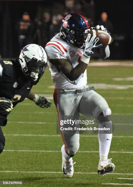 Brown of the Ole Miss Rebels makes a catch against Joejuan Williams of the Vanderbilt Commodores during the first half at Vanderbilt Stadium on...