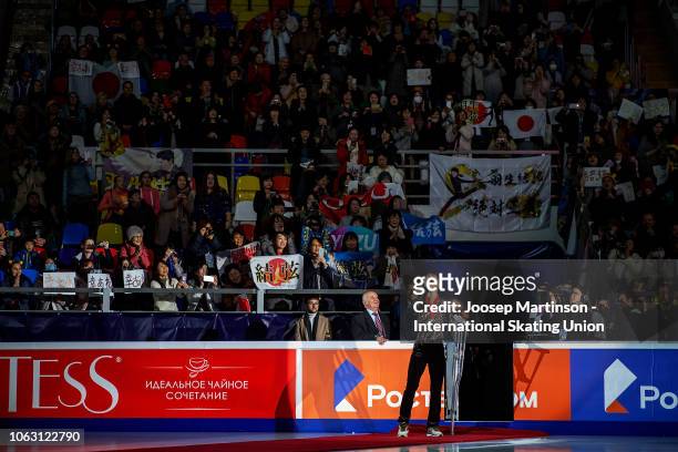 Yuzuru Hanyu of Japan screams to the crowd holding his crutches during Men's medal ceremony during day 3 of the ISU Grand Prix of Figure Skating,...