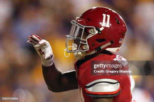 Henry Ruggs III of the Alabama Crimson Tide celebrates his touchdown in the first quarter of their game against the LSU Tigers at Tiger Stadium on...