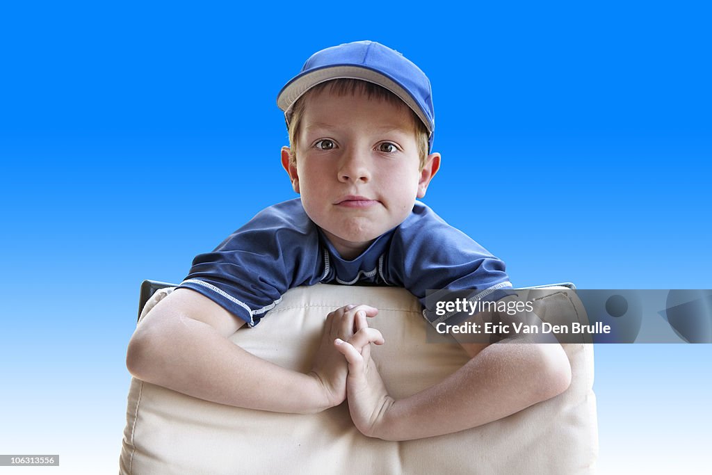 Boy in cap with blue background