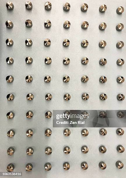 silver studs decorating vinyl material - bespickt stock-fotos und bilder