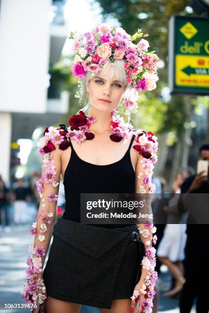 Model Elise Agee in floral hair and body art after the Dolce & Gabbana show during Milan Fashion Week Spring/Summer 2019 on September 23, 2018 in...