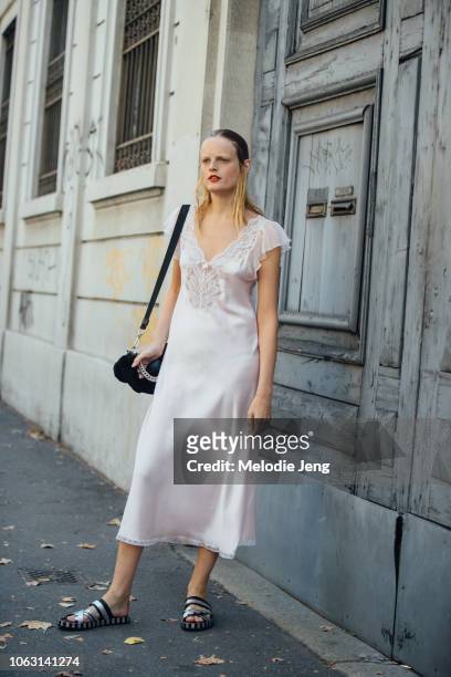 Model Hanne Gaby Odiele in a light pink white slip dress after the Marni show during Milan Fashion Week Spring/Summer 2019 on September 23, 2018 in...