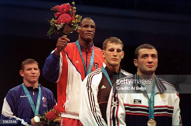 Felix Savon of Cuba wins his third gold medal in the Men's 91kg Boxing during the Sydney 2000 Olympic Games at the Exhibition Halls, Sydney,...