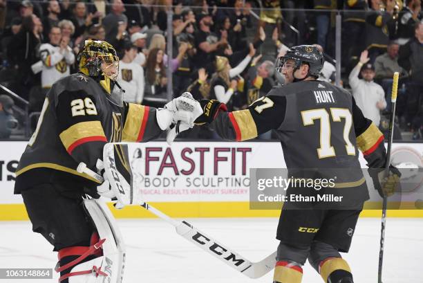 Marc-Andre Fleury of the Vegas Golden Knights congratulates Brad Hunt after he scored a first-period goal against the Carolina Hurricanes during...