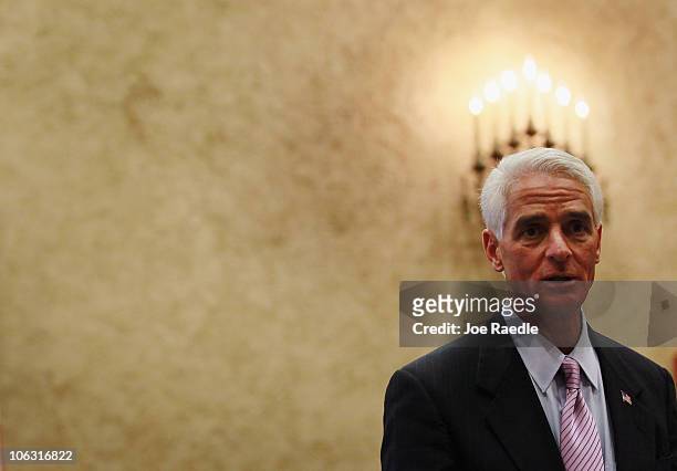 Independent Senatorial candidate Florida Governor Charlie Crist speaks during a swearing in ceremony for Miami-Dade County Judge Beth Bloom to the...