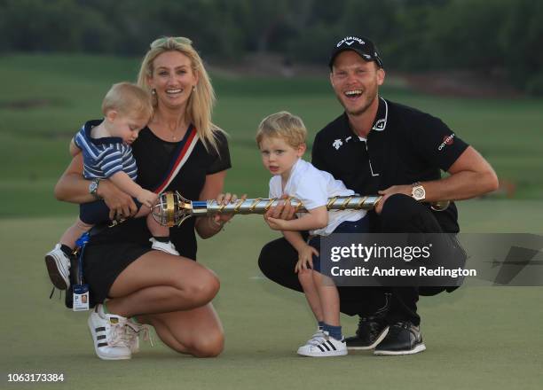 Danny Willett of England poses with his wife Nicole Willett after winning the DP World Tour Championship at Jumeirah Golf Estates on November 18,...