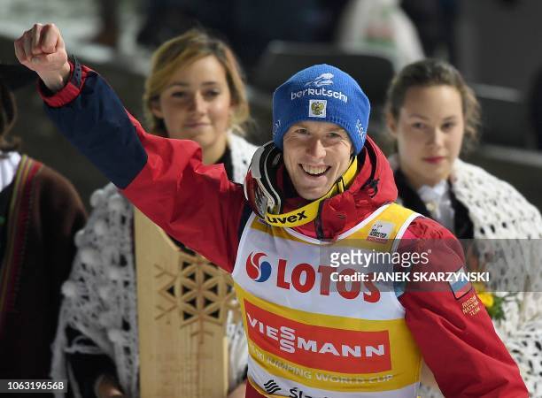 Russia's Evgeniy Klimov reacts during podium ceremony after the the FIS Ski Jumping World Cup in Wisla, Poland on November 18, 2018. - Russia's...
