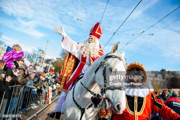 St. Nicholas, riding his horse Amerigo on November 18th 2018 in Amsterdam, Netherlands. With more than a kilometre of floats and boats, Amsterdam...