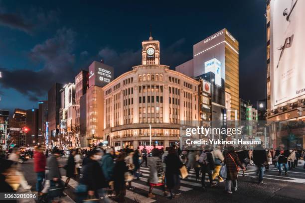 crowded ginza 4chome crossing at night - ginza crossing stock pictures, royalty-free photos & images