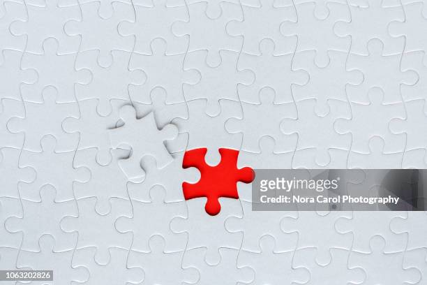 missing jigsaw puzzle piece - puzzleteile stock-fotos und bilder