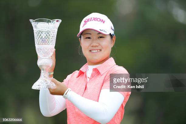 Nasa Hataoka of Japan holds the winner's trophy after winning the TOTO Japan Classic at Seta Golf Course on November 04, 2018 in Otsu, Shiga, Japan.