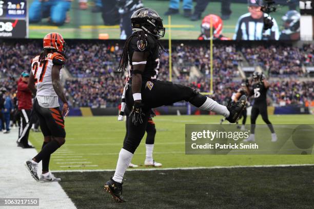 Running Back Alex Collins of the Baltimore Ravens celebrates after scoring a touchdown in the first quarter against the Cincinnati Bengals at M&T...