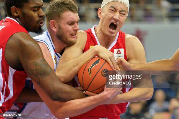Cole Aldrich of Tianjin Ronggang Gold Lions and Shao Yinglun of Qingdao DoubleStar Eagles fight for the ball during the 2018/2019 Chinese Basketball...