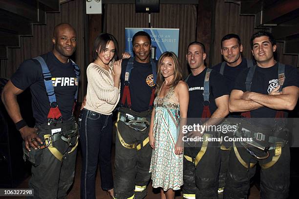 Wendy Straker, author of "Men At Work," with the 2006 FDNY Calendar Men and Naima Mora