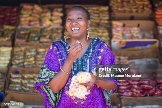 woman eating skopas - showus africa stock pictures, royalty-free photos & images