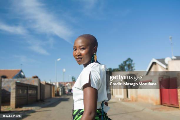 woman walking confidently - johannesburg stock-fotos und bilder