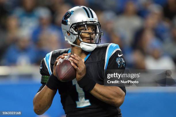 Carolina Panthers quarterback Cam Newton looks to pass during the first half of an NFL football game against the Detroit Lions in Detroit, Michigan...