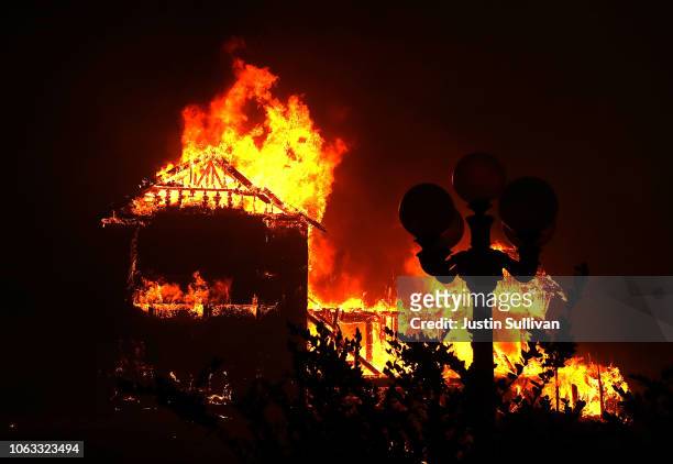 Home burns as the Camp Fire moves through the area on November 8, 2018 in Paradise, California. Fueled by high winds and low humidity, the rapidly...