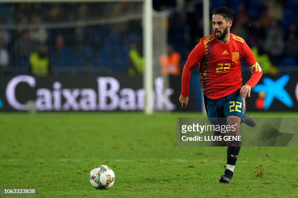 Spain's midfielder Isco runs with the ball during the international friendly football match between Spain and Bosnia-Herzegovina at the Gran Canaria...