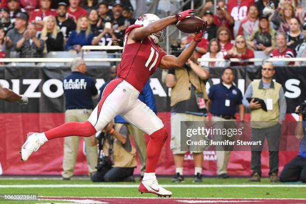 Larry Fitzgerald of the Arizona Cardinals makes an 18 yard touchdown reception in the first half of the NFL game against the Oakland Raiders at State...