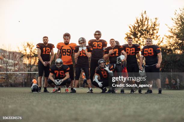 american football team on field - american football team stock pictures, royalty-free photos & images