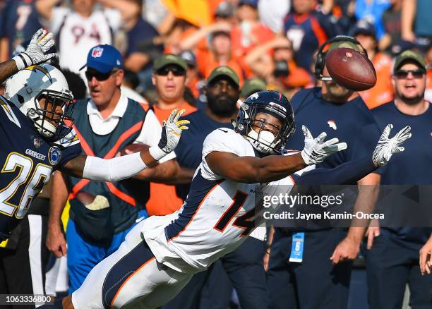 Wide receiver Courtland Sutton of the Denver Broncos makes a catch in front of cornerback Casey Hayward of the Los Angeles Chargers in the second...