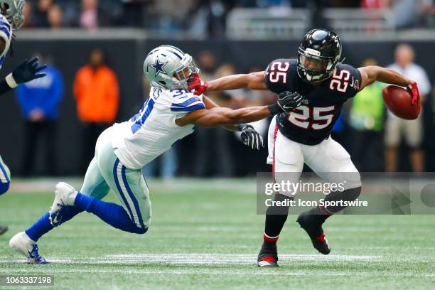 Atlanta Falcons running back Ito Smith is tackled by Dallas Cowboys cornerback Byron Jones in an NFL football game between the Dallas Cowboys and...