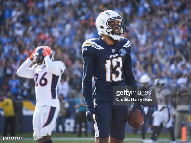 Wide receiver Keenan Allen of the Los Angeles Chargers celebrates his touchdown catch in front of strong safety Darian Stewart of the Denver Broncos...