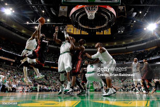 Dwyane Wade of the Miami Heat goes to the basket against the Boston Celtics during the season opening game on October 26, 2010 at the TD Garden in...