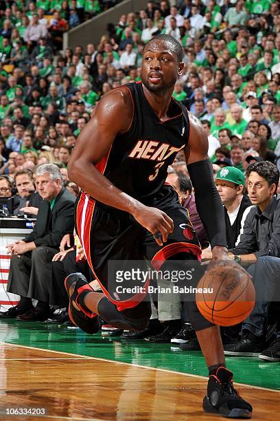 Dwyane Wade of the Miami Heat drives against the Boston Celtics during the season opening game on October 26, 2010 at the TD Garden in Boston,...