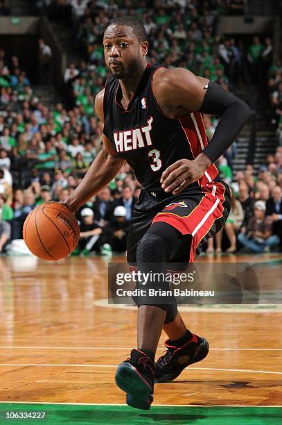 Dwyane Wade of the Miami Heat drives against the Boston Celtics during the season opening game on October 26, 2010 at the TD Garden in Boston,...