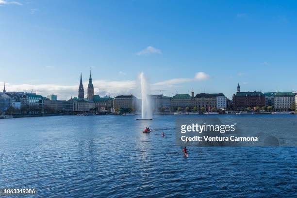canoeing on the binnenalster in hamburg - germany- - alster river stock pictures, royalty-free photos & images