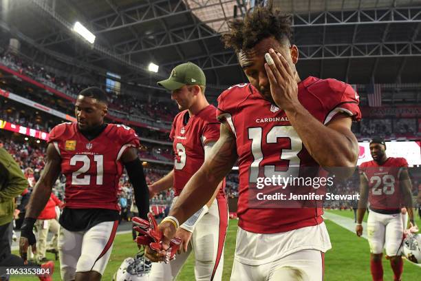 Christian Kirk of the Arizona Cardinals reacts while walking off the field in front of Josh Rosen and Patrick Peterson after the loss against the...