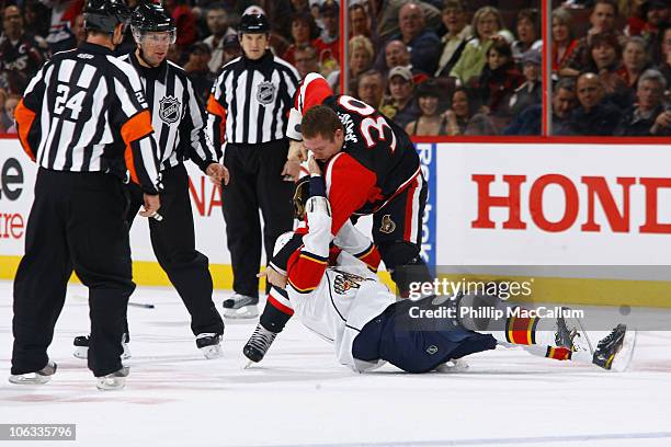 Matt Carkner of the Ottawa Senators takes down Darcy Hordichuk of the Florida Panthers in a fight during a game at Scotiabank Place on October 28,...