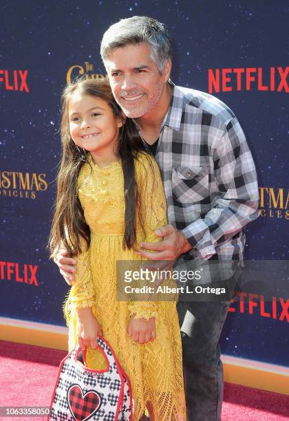 Actor Esai Morales daughter and Mariana Oliveira Morales arrive for the Premiere Of Netflix's "The Christmas Chronicles" held at Fox Bruin Theater on...