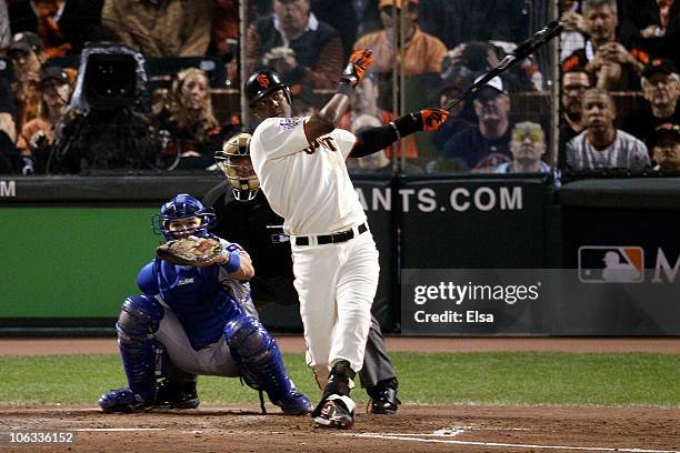 Edgar Renteria of the San Francisco Giants hits a fifth inning solo home run off of C.J. Wilson of the Texas Rangers in Game Two of the 2010 MLB...