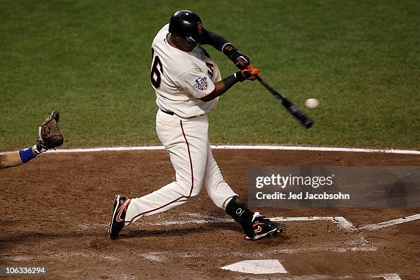 Edgar Renteria of the San Francisco Giants hits a fifth inning solo home run off of C.J. Wilson of the Texas Rangers in Game Two of the 2010 MLB...