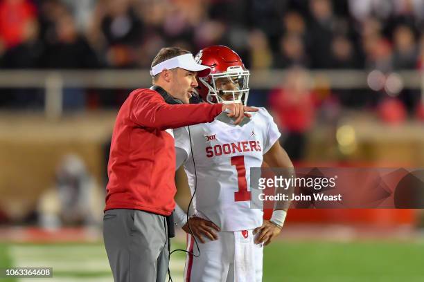 Head coach Lincoln Riley talks with Kyler Murray of the Oklahoma Sooners during the game against the Texas Tech Red Raiders on November 3, 2018 at...