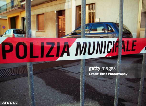 police cordon tape in a street of a small town in sicily, italy - mafia stock-fotos und bilder