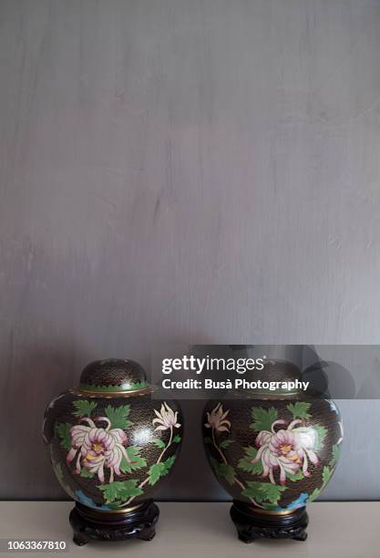 two antique chinese porcelain vases on a grey background with copyspace - home auction stock pictures, royalty-free photos & images