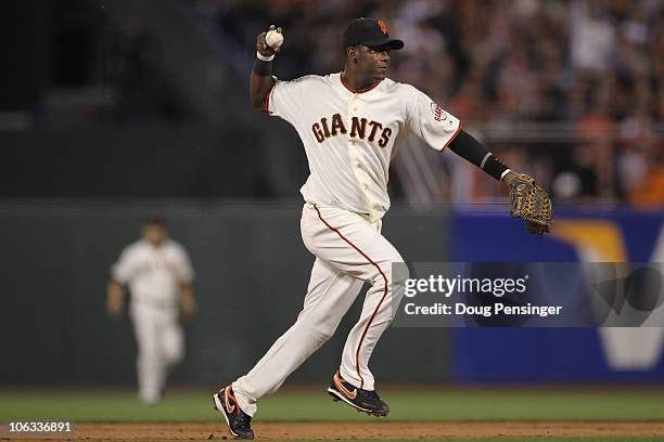 Edgar Renteria of the San Francisco Giants throws the ball to first base for an out in the sixth inning while taking on the Texas Rangers in Game Two...