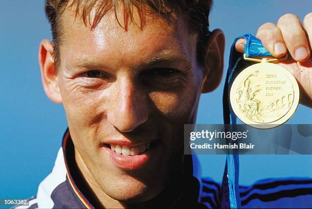 Andreas Dittmer of Germany celebrates on the podium after the Mens C1 1000m Canoeing at the Sydney International Regatta Centre on day 15 of the...