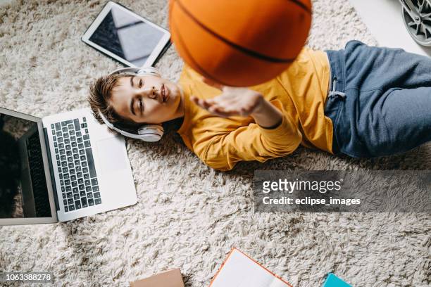 nice day to hang out with ball - basketball teen stock pictures, royalty-free photos & images