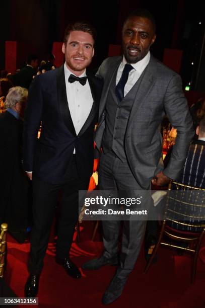 Richard Madden and Idris Elba attend The 64th Evening Standard Theatre Awards at the Theatre Royal, Drury Lane, on November 18, 2018 in London,...