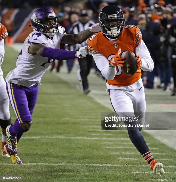 Eddie Jackson of the Chicago Bearsnreturns an interception for a touchdown past Stefon Diggs of the Minnesota Vikings at Soldier Field on November...