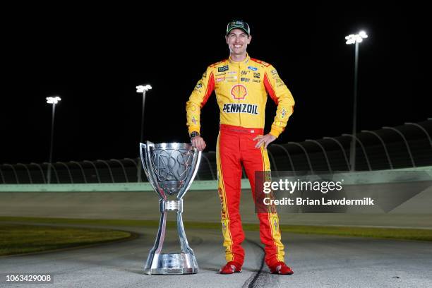 Joey Logano, driver of the Shell Pennzoil Ford, poses for a photo after winning the Monster Energy NASCAR Cup Series Ford EcoBoost 400 and the...